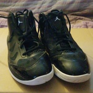 All black with white trimming Jordans